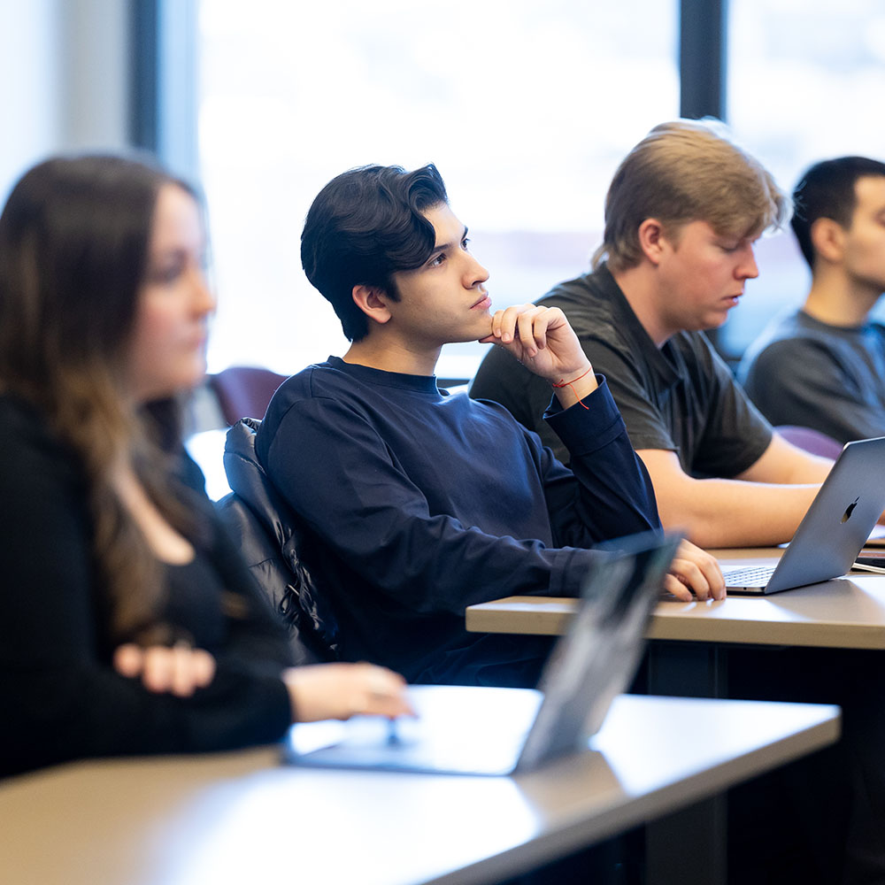 a student sits in a classroom